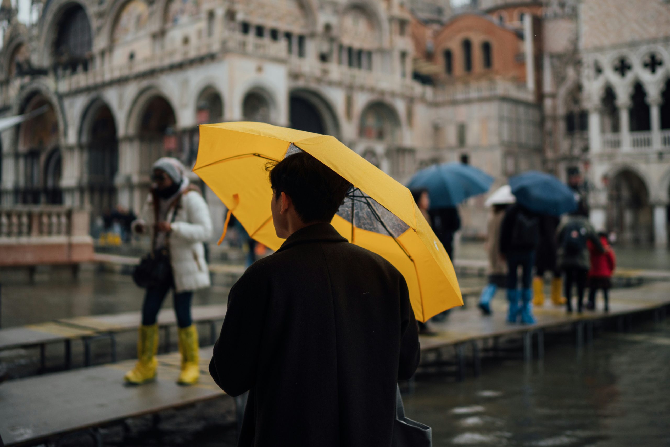 Comparison between traditional bulky rain jacket and sleek modular rainwear system